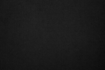 Black paper texture background. Black blank cardboard sheet page. Old vintage page dark grunge vignette. Pattern rough art rustic grunge letter. Material cardboard with copy space for luxury text.