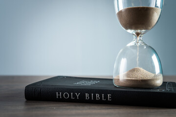 Hourglass and bible