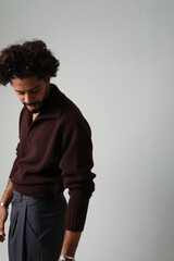 Vertical portrait of casual guy, with curly hair. Mind set and mental health.