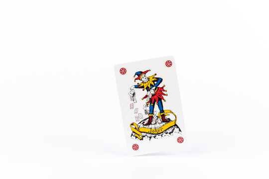 playing poker cards, joker on white background