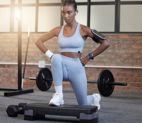 Fitness, exercise and a woman with music for lunges at gym for health and wellness training workout. Indian athlete person listening to earphones for motivation and inspiration to train strong body