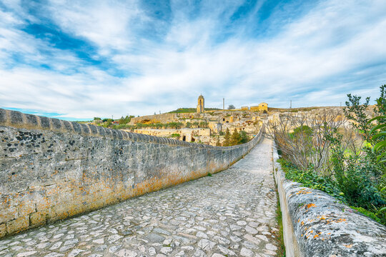 Breathtaking view on Gravina in Puglia ancient town, bridge and canyon at sunris
