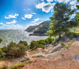 Fototapeta na wymiar Above the cliffs at the coastline of Vieste. Summer rocky sea coast Baia Di Campi Vieste on the Gargano peninsula