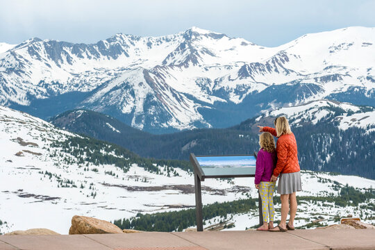 Mother and daughter at Trailridge Road looking at Never Summer Range, Rocky Mountain National Park, Estes Park, Colorado, USA