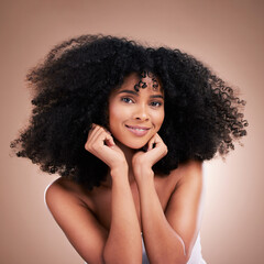 Fototapeta na wymiar Hair, afro and portrait of black woman with smile on brown background for wellness, shine and natural glow. Salon, luxury beauty and happy girl face with curly hairstyle, texture and growth treatment