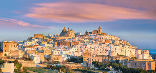 Attractive view on Ostuni white town skyline and Madonna della Grata church