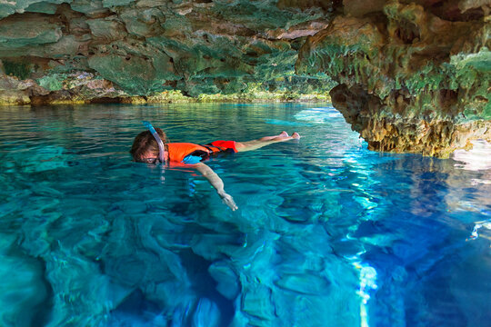 Man snorkeling in Cenote Chikin Ha, Playa del Carmen, Mayan Riviera, Yucatan Peninsula, Mexico
