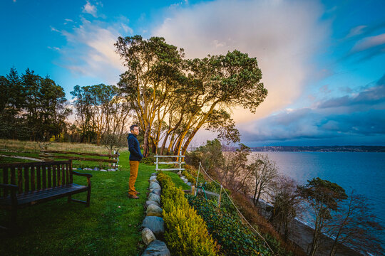 A man is standing near Puget Sound