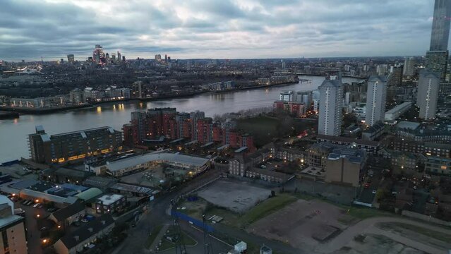 London City skyline at dusk near Canary Wharf UK drone aerial view
