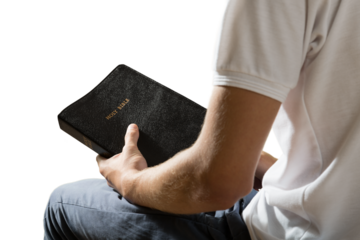 Man holding bible book isolated on white background