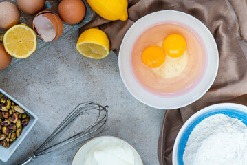 Ingredients for lemon and pistachio cake - overhead view