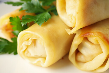 Concept of tasty food, thin pancakes with filling