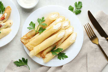 Concept of tasty food, thin pancakes with filling, top view