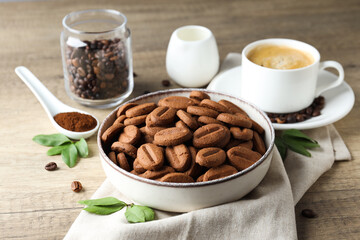 Concept of tasty snack for hot drink - cookies in the shape of coffee seeds