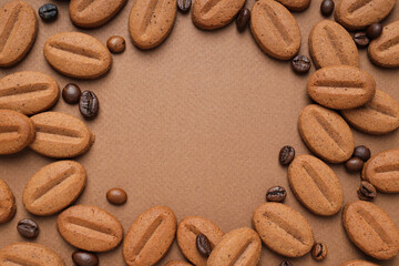 Concept of tasty snack for hot drink - cookies in the shape of coffee seeds