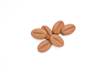 Cookies in the shape of coffee seeds, isolated on white background