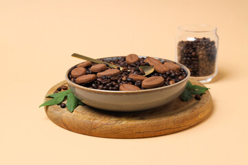Concept of tasty snack for hot drink - cookies in the shape of coffee seeds