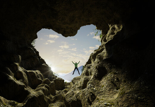 Man comes out of heart shaped cave and jumps up for joy