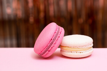 Sweet colorful macarons  on pink background. Tasty colourful macaroons. High quality photo