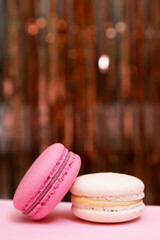 Sweet colorful macarons  on pink background. Tasty colourful macaroons. High quality photo