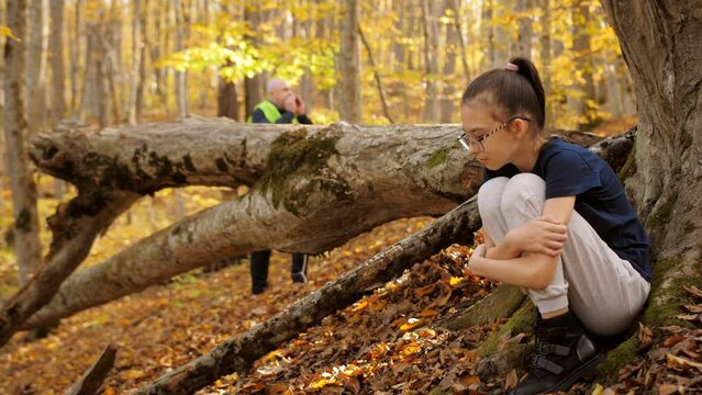 Search for lost children in the forest. Parents together with volunteers are conducting a search operation in the autumn forest to search for missing an 11-year-old girl 
