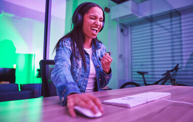 Woman, headphones or success fist in neon gaming, wow esports or challenge winner in night basement. Smile, happy or excited gamer cheering for game victory, cyberpunk achievement or yes expression