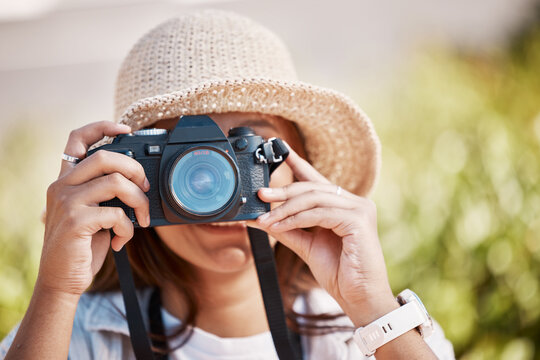 Woman, hands and camera lens in photography for nature travel, adventure or sightseeing scenery. Female photographer in focus taking photo or picture for memory, destination or location outdoors