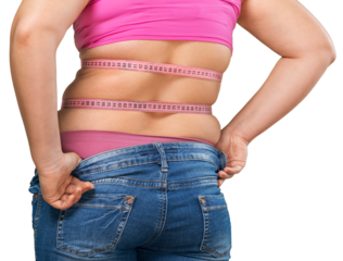 Female who has gained weight and can no longer fit into her jeans - isolated image
