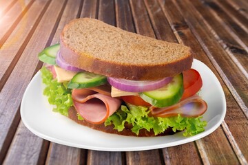 Tasty fresh sandwich with cheese and vegetables