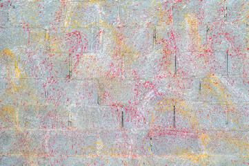 Concrete block wall background and texture.Colorful Concrete block wall as background,color painting on concrete  block  wall .Dropping acrylic paint on the concrete wall.Street art - graffiti.