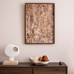 Interior design of aesthetic and elegant room with mock up poster, wooden commode, glass vase , decoration and personal accessories. Elegant home decor. Template.