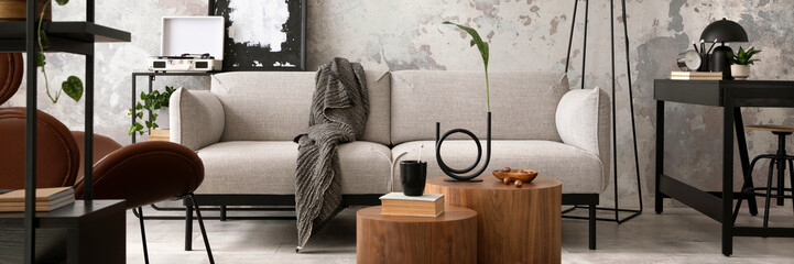 The stylish compostion at living room interior with design gray sofa, wooden coffee table, brown armchair and elegant personal accessories. Loft and industrial interior. Home decor. Template. . © FollowTheFlow