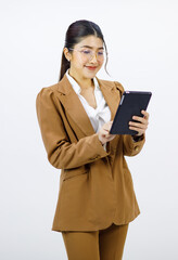 Millennial Asian young cheerful professional successful female businesswoman entrepreneur ceo in formal business suit and eyeglasses standing holding touchscreen tablet computer on white background