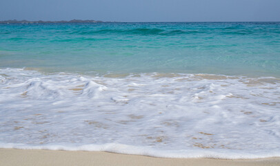 Fototapeta na wymiar beach with white sand and waves