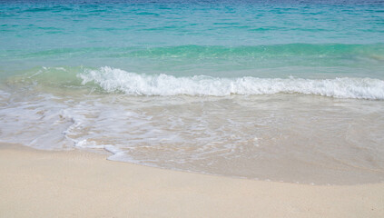Fototapeta na wymiar white sand on the beach and waves