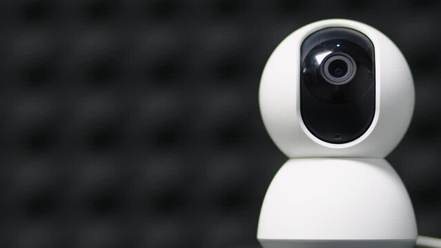 A surveillance camera takes a close-up video of the situation in a public place. Electronic devices for security and control. Recording equipment