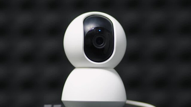 A surveillance camera takes a close-up video of the situation in a public place. Electronic devices for security and control. Recording equipment