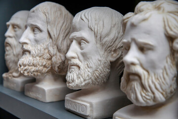 Plaster bust of philosopher Aristoteles and group of other busts. Portraits of ancient historical...