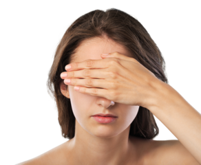 A young scared woman covering eyes with hands
