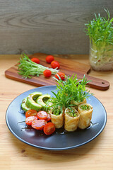 Delectable Freshly Harvest Water Spinach Microgreens Egg Rolls with Tomato and Avocado Salad