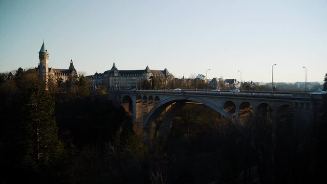 Luxembourg Adolf Bridge and city skyline, spuerkees tower airplane. 4k 24fps. Tripod. 