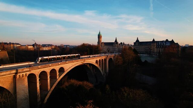 Luxembourg Adolf Bridge and city skyline, spuerkees tower airplane. 4k 24fps. Tripod. 