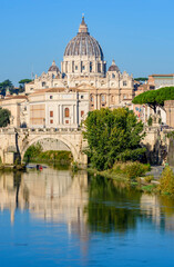 Fototapeta premium St Peter's basilica in Vatican and St. Angel bridge over Tiber, Rome, Italy