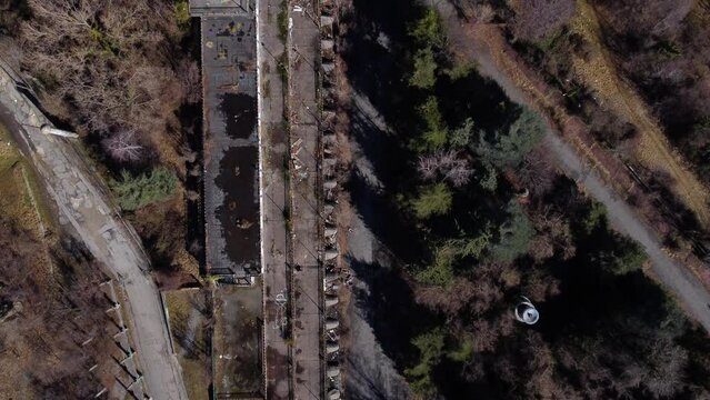 Abandoned and ruined landscape in Consonno, Italy. Cenital aerial shot.