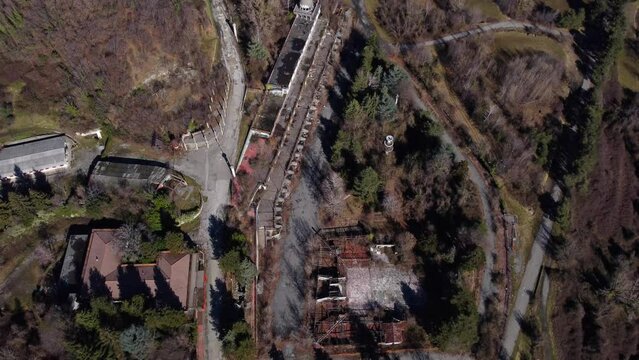 Cenital aerial shot. over a abandoned and ruined landscape in Consonno, Italy. Cenital aerial shot.