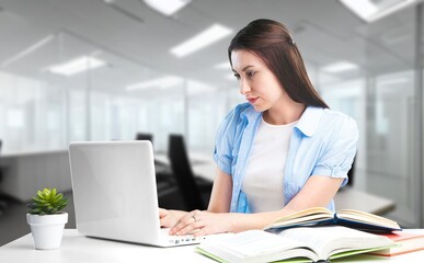 Young student woman working with computer