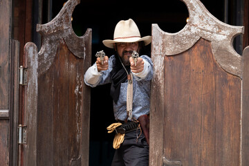 Mexican cowboy aiming gun fighting bank robbery cowboy