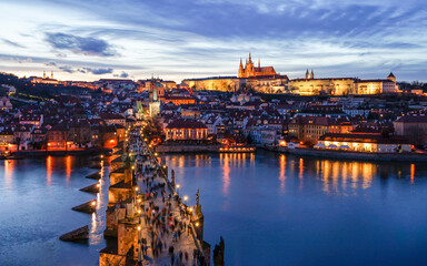 Naklejka premium Historic Prague sunset aerial panorama with Prague Castle and Charles Bridge, popular tourist destination