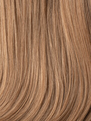 Natural blonde wig close-up. Hair texture. Hair dye, salon care, home coloring. 