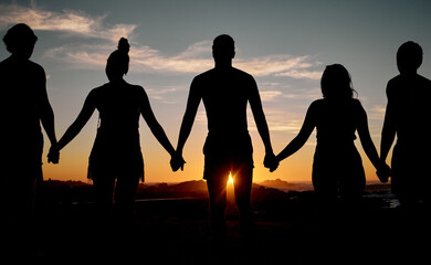 Friends, bonding or holding hands on sunset beach silhouette, nature freedom or community trust...